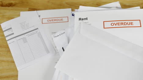 A-stack-of-bills-and-letters-with-a-rent-overdue-notice