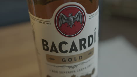 Close-Up-Rack-Focus-of-a-Bacardi-Gold-Rum-Bottle