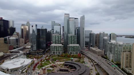 Aerial-view-over-the-Railway-Museum-and-the-Roundhouse-Park,-towards-city-high-rise,-cloudy-day-in-Toronto,-Canada