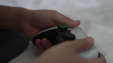 Close-Up-View-Of-Male-Hands-Holding-PS5-Controller-Pressing-Buttons