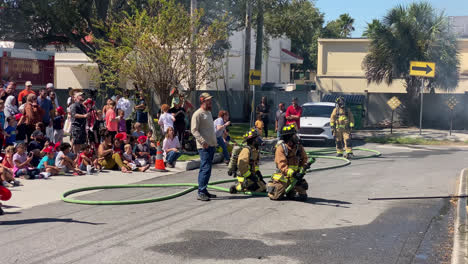 Side-angle-shot-of-The-Florida-Fire-Sprinkler-Association-performing-an-on-site-education-program-on-fire-sprinkler-saving-lives,-Florida