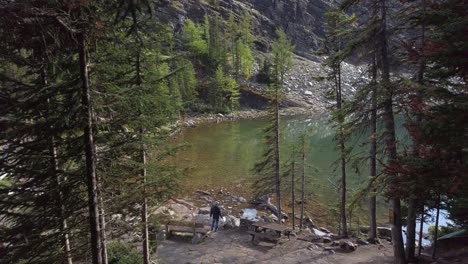 Lake-Agnes-tourists-looking-at-sign-high-angle-Alberta-Canada-pan