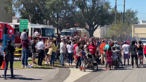 Crowd-panning-shot-of-The-Florida-Fire-Sprinkler-Association-performing-an-on-site-education-program-on-fire-sprinklers-saving-lives,-Florida