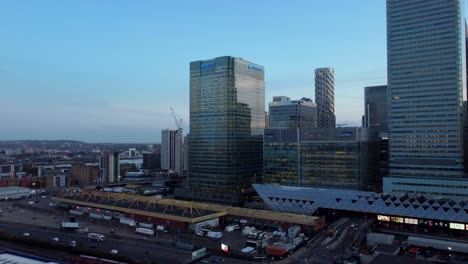 Drone-shot-Barclays-Bank-modern-glass-skyscraper-in-Canary-Wharf,-London