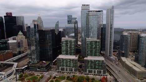 Aerial-view-towards-office-buildings,-in-South-Core,-Toronto,-cloudy-Ontario,-Canada