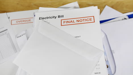 Close-up-of-a-stack-of-bills-and-letters-with-an-electricity-bill-final-notice