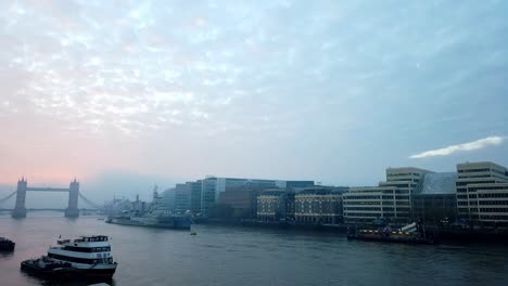 Early-morning-motion-lapse-with-the-Shard-skyscraper,-London-Bridge-Hospital,-Tower-Bridge-and-the-River-Thames