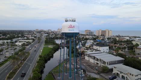 Jacksonville-Beach-FL-Water-Tower-and-A1A-at-Dusk---Aerial-Orbiting-Right