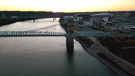 Aerial-view-around-the-Roebling-Bridge,-sunset-in-Cincinnati,-Ohio,-USA---circling,-drone-shot