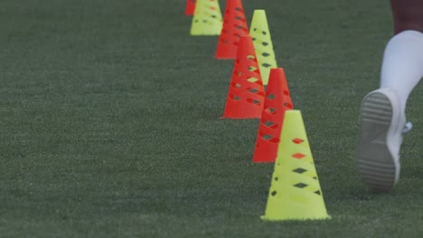 Football-training-exercise---ball-control-between-cones,-slow-motion-closeup