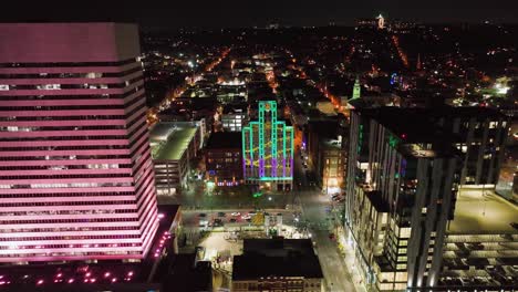 Building-Illuminated-with-a-colorful-artwork,-at-the-BLINK-festival-in-Cincinnati,-Ohio,-USA---Aerial-view