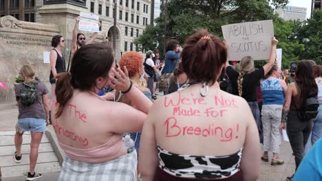 Two-Women-with-Pro-Choice-slogans-painted-on-their-backs-at-Pro-Choice-rally-at-the-Ohio-Statehouse-on-June,-26,-2022
