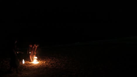 Fire-performance-show-with-burning-torches-on-the-beach-in-Phuket-tropical-island