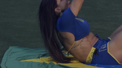 Beautiful-Brazilian-soccer-player-doing-sit-ups-before-the-game