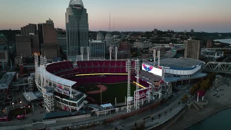 Aerial-view-towards-the-Great-American-Ball-Park,-dusk-in-Cincinnati,-USA---tilt,-drone-shot