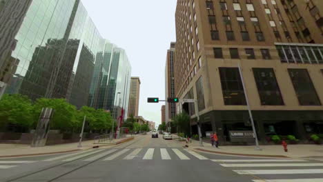 Driving-in-downtown-Oklahoma-city---upward-looking-camera-captures-the-way-skyscrapers-reflect-in-each-other