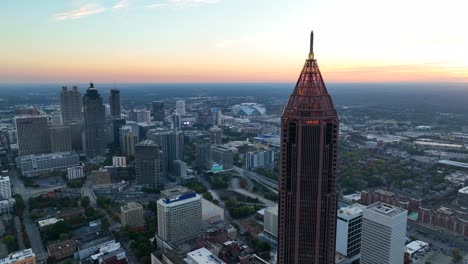 Cinematic-high-aerial-view-of-Atlanta-skyline-and-Bank-of-America-building-at-sunset