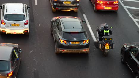 Family-cars-rushing-in-during-traffic-jam-at-Ayalon-highway-Tel-Aviv