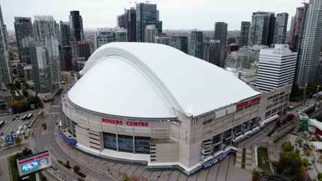 Aerial-view-around-the-Rogers-centre-arena-in-cloudy-Toronto,,-Canada---orbit,-drone-shot