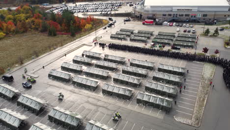 Aerial-pan-of-funeral-procession-for-police-killed-in-duty-in-Canada