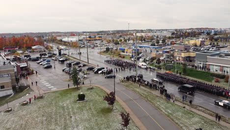 Aerial-view-of-police-officer's-funeral-honors-ceremony-for-two-murdered-Policemen-held-outside-Sadlon-Arena-in-Barrie,-Ontario,-Canada
