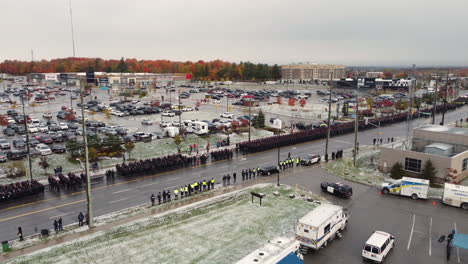 Aerial-view-of-police-parade-standing-on-road-at-funeral-procession-for-police-killed-in-duty-in-Canada