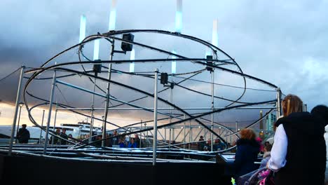 Interactive-public-illuminated-spiral-light-looper-neuron-artwork,-Liverpool-pier-head-river-of-light-event