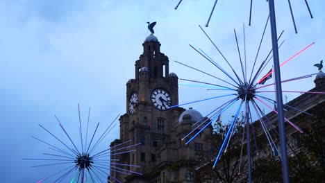 Flashing-neon-electric-dandelions-artwork-at-Liverpool-pier-head-river-of-light-event-at-Liver-building