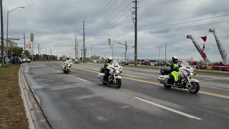 Police-motorcycle-parade-honoring-Canadian-cops-killed-in-duty,-pan