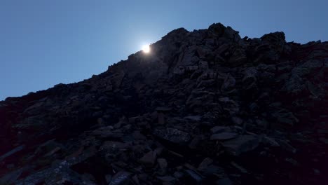 Hiker-in-distance-back-lit-sun-revealed-slow-motion-Kananaskis-Alberta-Canada