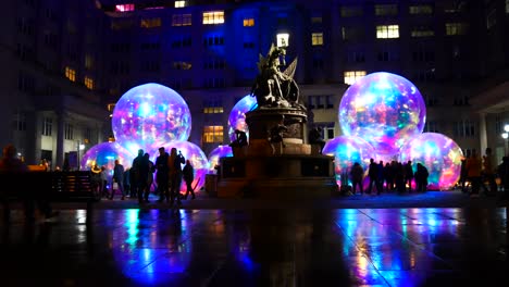 Public-interaction-Evanescent-glowing-bubble-artwork-at-Exchange-flags-square-Nelson-monument-Liverpool-River-of-light-show