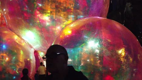 Public-audience-at-Evanescent-glowing-bubble-artwork-at-Exchange-flags-square-Nelson-monument-Liverpool-River-of-light-show