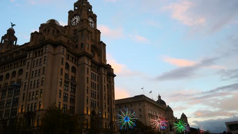 Liver-building-flashing-neon-electric-dandelions-artwork-at-Liverpool-pier-head-river-of-light-event