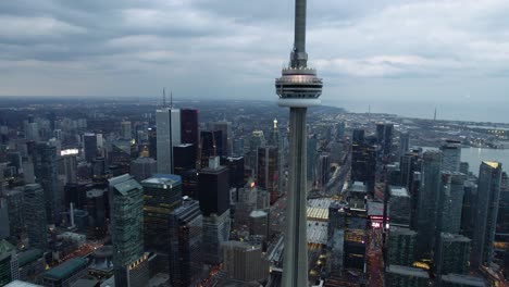 Aerial-view-of-the-CN-Tower,-the-Union-Station-and-the-Old-Toronto,-dusk-in-Ontario,-Canada---panoramic,-drone-shot