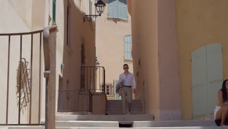 Business-man-walking-down-the-stairs-of-st-Tropez-in-France