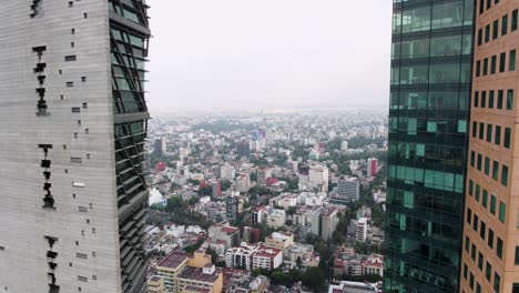 Aerial-dolly-out-revealing-tall-Reforma-towers-amidst-Mexico-developed-City