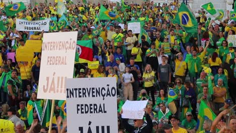 Protesting-the-October-2022-election-results,-Bolsonaro-supporters-protest-with-posters-and-wave-flags