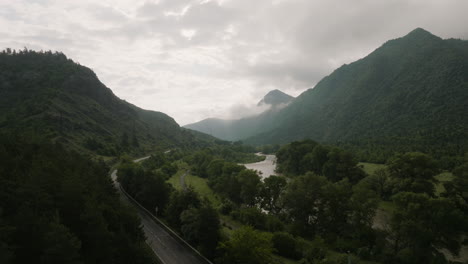 Panoramic-View-Forested-Mountains-And-Asphalt-Road-During-Dawn-In-Georgia