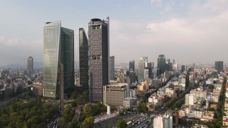 Aerial-dolly-in-towards-tall-BBVA-building-in-famous-Reforma-avenue-of-Mexico-City