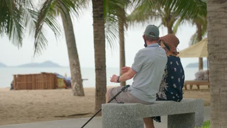 Old-couple-talking-on-the-beach
