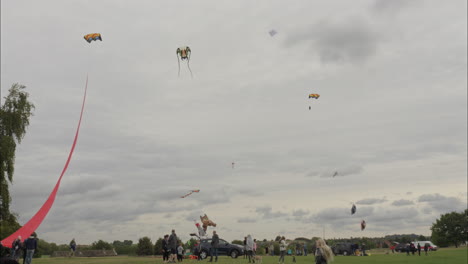 A-large-crowd-of-people-fly-kites-on-Heath-Common-Wakefield-during-a-kite-festival-on-a-dull-cloudy-day