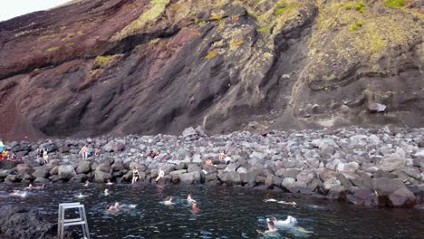People-in-Azores-Taking-Bath-in-Volcanic-Thermal-Spring-at-Coastline