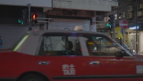 People-waiting-for-the-signal-light-goes-on-one-of-the-Hongkong-streets