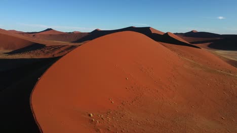 Drone-shot-of-the-Namib-desert-in-Namibia---drone-is-flying-over-beautifully-red-shimmering-Dune-45