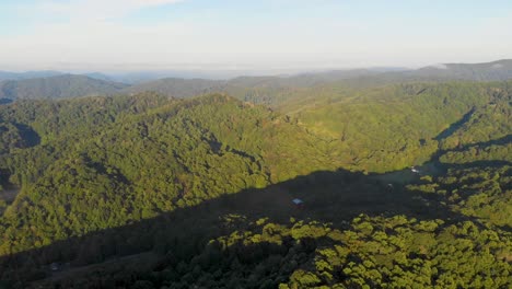 4K-Drone-Video-Flying-High-Above-Trees-Along-Mountain-Road-in-Smoky-Mountains-near-Asheville,-NC-on-Foggy-Morning