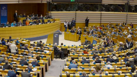 European-Parliament-congress-plenary-hall-crowded-with-representatives,-Brussels-Belgium---Tilt-up-shot