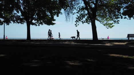 Wide-exterior-shot-of-people-enjoying-a-summer-day-on-the-boardwalk-by-Lake-Ontario
