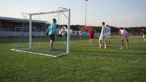 Football-tournament-match-in-Croatia,-city-of-Durdenovac,-Popular-sports-Soccer,-played-by-amateurs-of-all-ages,-Two-players-Failed-to-score-a-goal