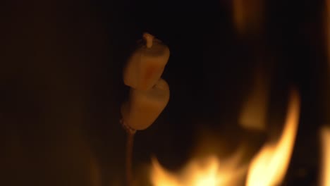 Delicious-Marshmallow-On-A-Skewer-Is-Grilled-At-Campfire