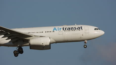 AirTransat-passenger-jet-liner-landing-at-Toronto-airport,-follow-view